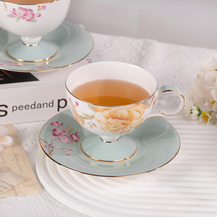 4 Ceramic Tea Cup and Saucer Set with Gold Trim - Image 1