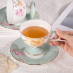 Ceramic Tea Cup and Saucer Set with Gold Trim - Image 2