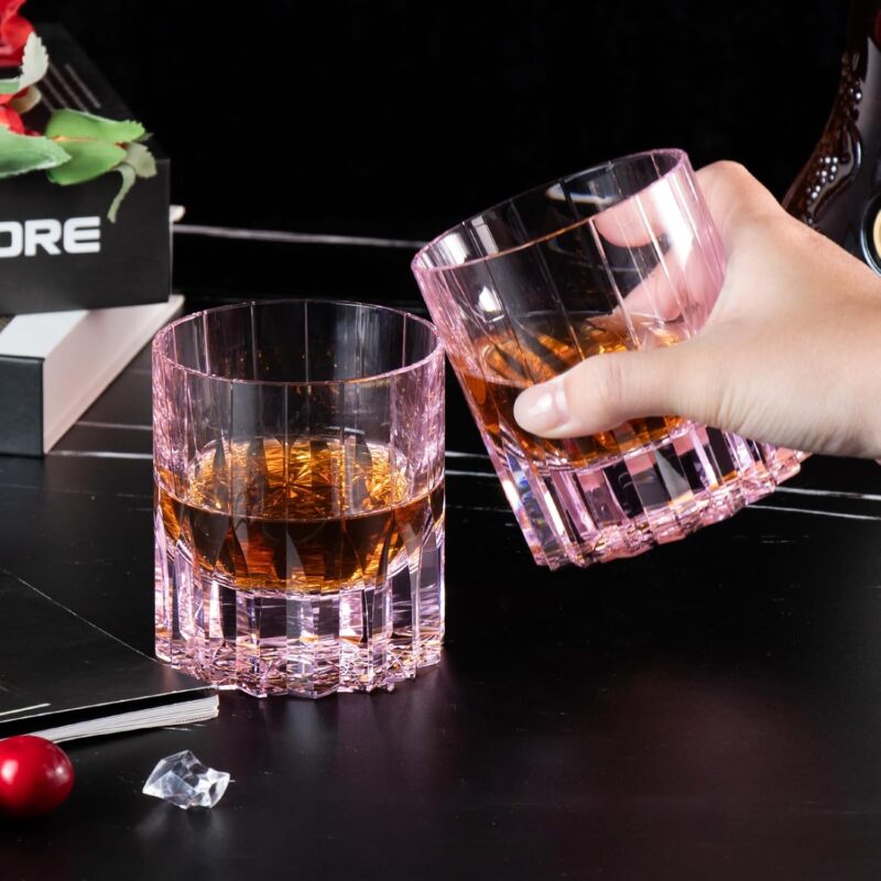 Pink KAMMAK crystal whiskey glasses with amber spirits