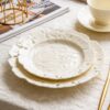KAMMAK Ceramic Decorative Plate Set of 2, Porcelain Plates for Kitchen Dining Room Wine Cabinet Home Decor, Vintage Collector Plates with 2 Display Stand, Cream White Leaves... KAMMAK 8CZSY006+07 decorative serving plate styled on dining table image 1