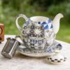 KAMMAK Tea for One, Porcelain Teapot and Cup Set with Infuser, Bone China Tea Pot and Saucers Set, Ceramic Tea Set for Party, Black and White Tea Cups and Saucer Set for Coffee,... KAMMAK 8CZYX017 ceramic teapot styled home decor setting image 5