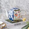 KAMMAK Teapot with Handle, Vintage Porcelain Tea Pot with Gold Trim, Blooming & Loose Leaf Teapot, Festive Holiday Serveware, Gifts for Women, Doucai 32 oz KAMMAK 8CZYX009 ceramic teapot side angle view showing silhouette