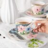 KAMMAK Tea Cups and Saucers Set of 2, Porcelain Coffee Cups, Stackable Espresso Mugs, Ceramic Demitasse for Coffee, Latte, Americano, Tea, Green + Pink KAMMAK 8CZNX045+46 ceramic cup and saucer close-up material texture detail image 4