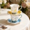 KAMMAK Tea Cups and Saucers Set of 2, Porcelain Coffee Cups, Stackable Espresso Mugs, Ceramic Demitasse for Coffee, Latte, Americano, Tea, Relief Yellow + Blue KAMMAK 8CZNX015+16 ceramic cup and saucer front view for product display
