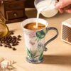 KAMMAK Bone China Mugs Set of 2, Ceramic Tea and Coffee Cups, 10.8oz Porcelain Tall Mugs Set, Hand painted Cappuccino Mug for Latte, Americano, Breakfast Cereal, Hot Cocoa,... KAMMAK 8CZNX032 ceramic cup and saucer front view for product display