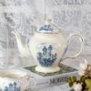 KAMMAK Teapot with Handle, Vintage Porcelain Tea Pot with Gold Trim, Blooming & Loose Leaf Teapot, Festive Holiday Serveware, Gifts for Women, Vintage Blue 33 oz KAMMAK 8CZSY002 ceramic teapot side angle view showing silhouette