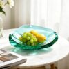 KAMMAK Crystal Glass Fruit Bowl, Hand Blown Decorative Dessert Plate | Green, Luxury Centerpiece, Aesthetic Counter Decor, Colored Modern Art, For Party, SXY10 KAMMAK 8GPSXY010 decorative serving plate side angle view showing silhouette