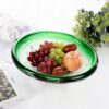KAMMAK Glass Fruit Bowl, Luxury Centerpiece Glass Bowl, Hand Blown Decorative Dessert Plate, Green Aesthetic Counter Decor, Colored Modern Art Serving Bowls for Party (SXY06) KAMMAK 8GPSXY006 decorative serving plate side angle view showing silhouette