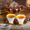 Orange and blue KAMMAK tea cups served beside a glass teapot KAMMAK 7KPSP433N ceramic cup and saucer side angle view showing silhouette