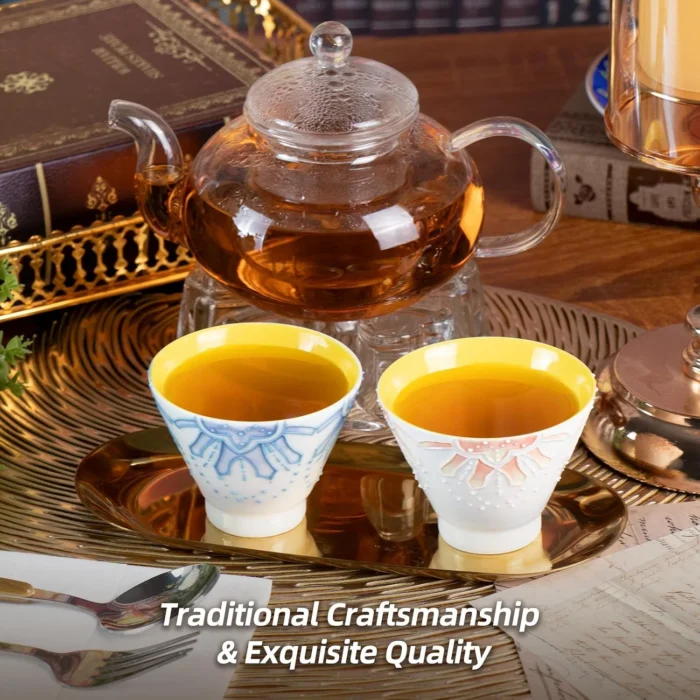 Orange and blue KAMMAK tea cups served beside a glass teapot KAMMAK 7KPSP433N ceramic cup and saucer side angle view showing silhouette