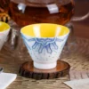Close view of the blue KAMMAK ceramic tea cup with raised decoration KAMMAK 7KPSP433N ceramic cup and saucer scale and proportion view image 6