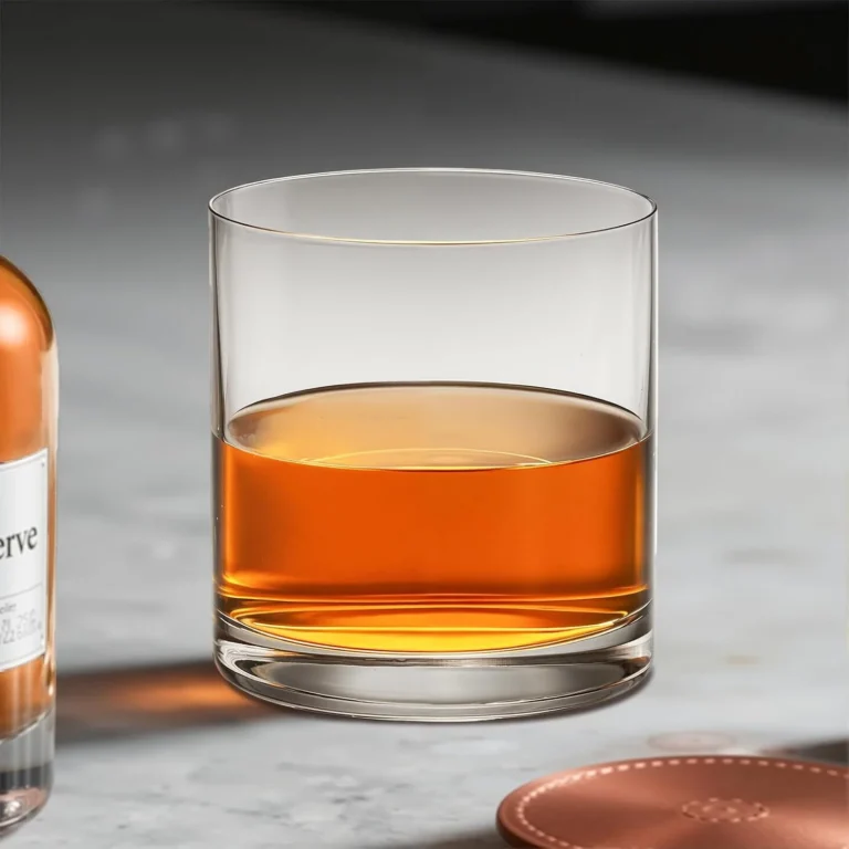 Single clear KAMMAK 777N whiskey glass filled with amber spirits