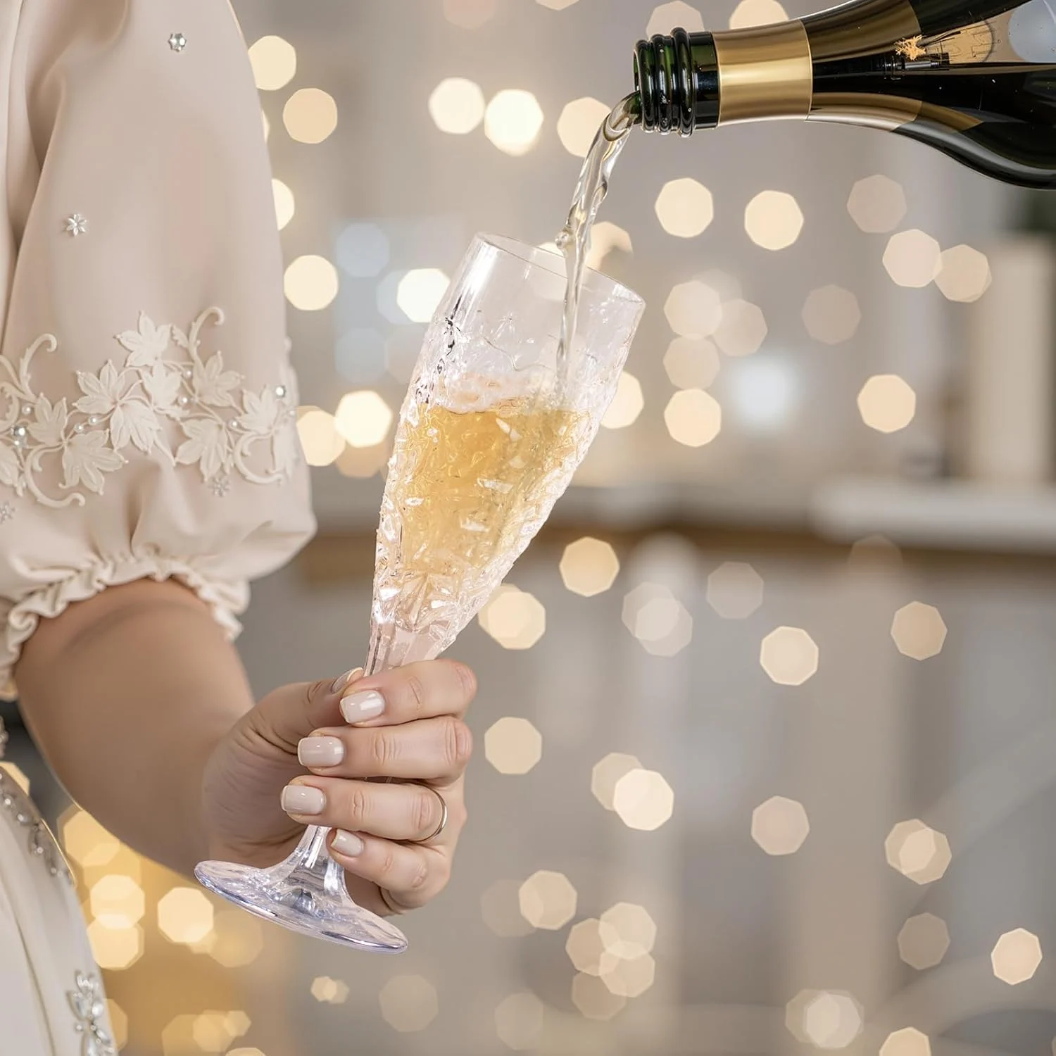 KAMMAK champagne flute being filled at a celebration