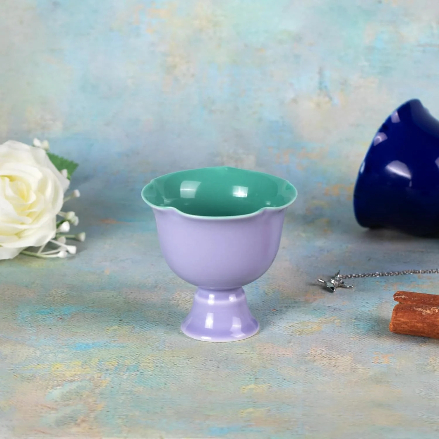 Lavender purple stemmed ceramic tea cup with green interior