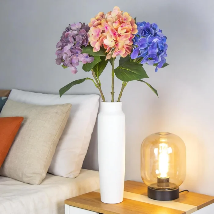 Multicolor hydrangea display in a white vase by a sofa KAMMAK 8KPFZH004 home decor product decorative craft detail image 7