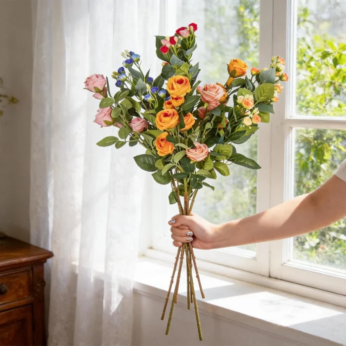 Long multicolor artificial flower stems held beside a window KAMMAK 8KPFZH005 home decor product side angle view showing silhouette