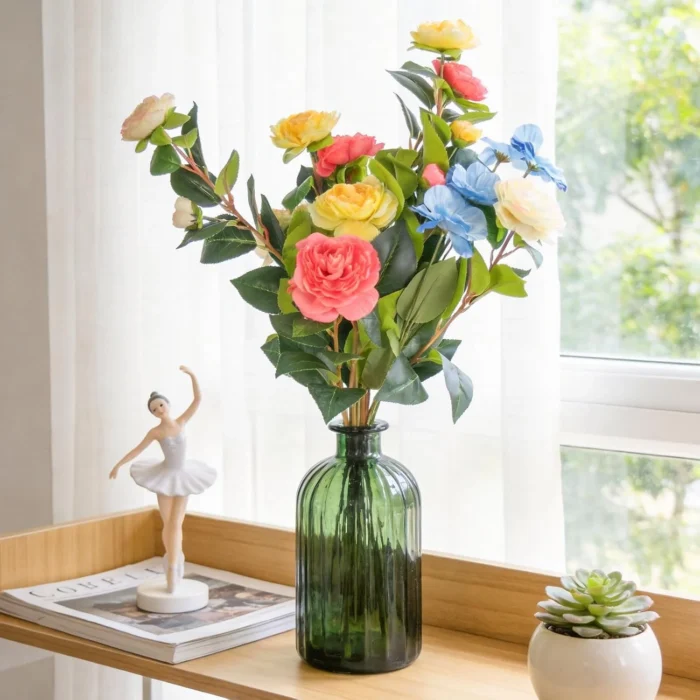 Tall colorful flower stems in a green glass bottle KAMMAK 8KPFZH011 home decor product styled home decor setting image 5