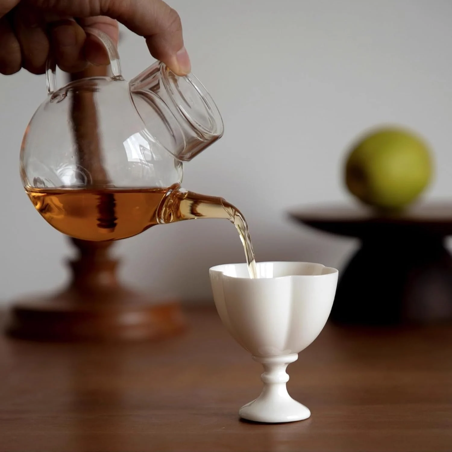 Tea poured into the white short-stem ceramic cup