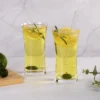 Pair of tall Collins glasses served with lime and rosemary drinks KAMMAK 7KPSP776N home decor product styled home decor setting image 5