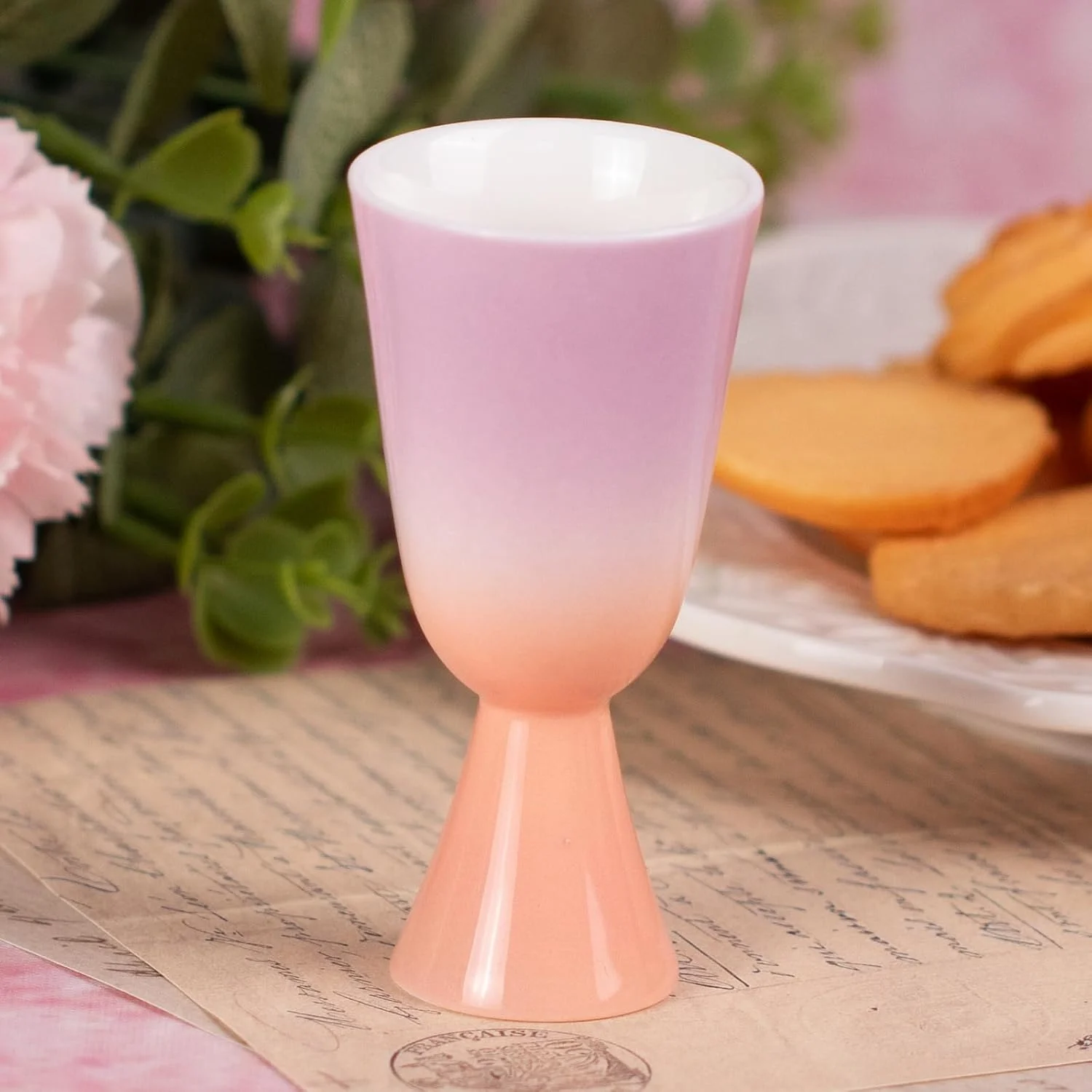 Pink gradient ceramic tea cup with a tall narrow stem
