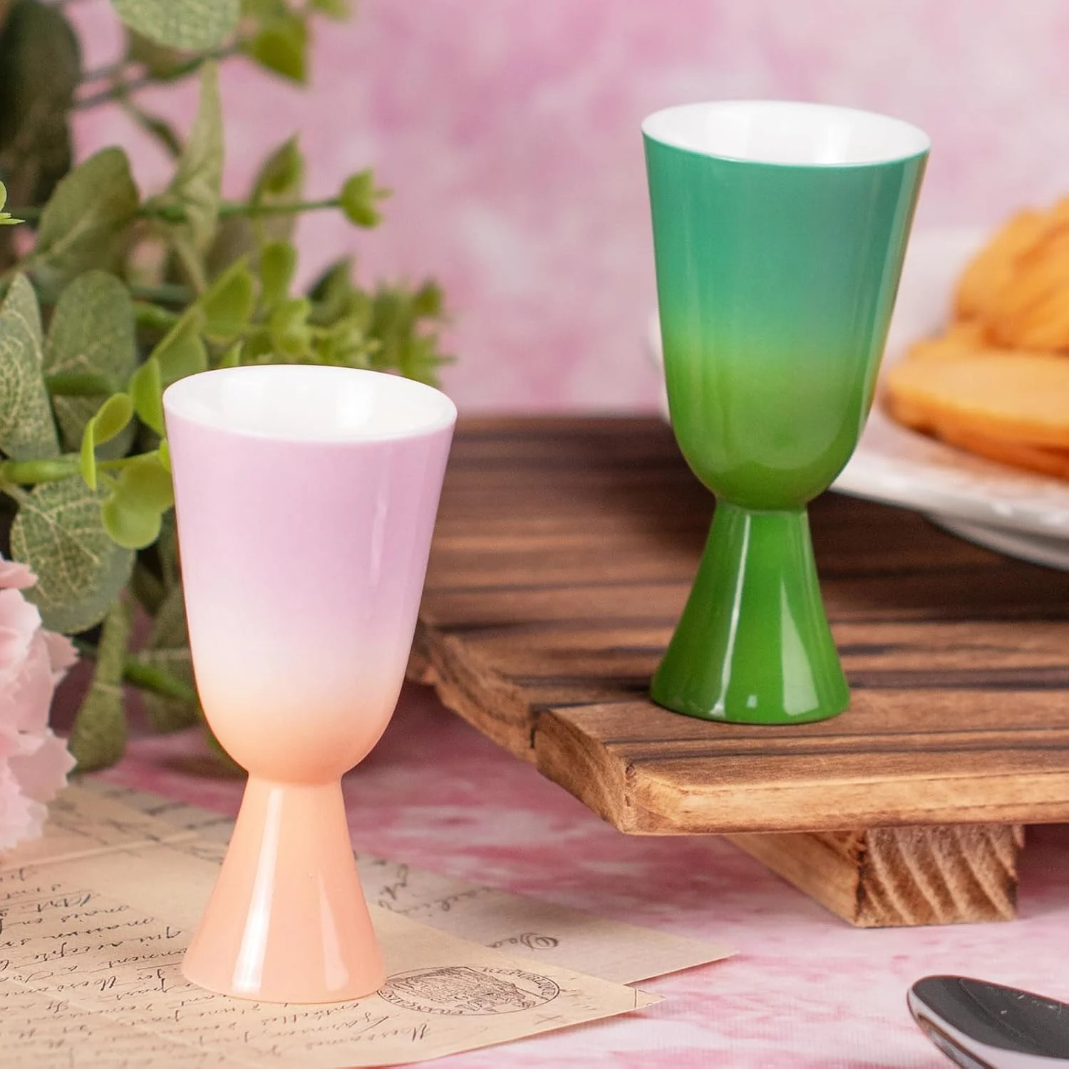 Green and pink gradient tea cups arranged together