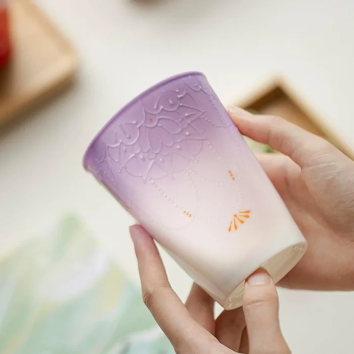 Tall lavender gradient ceramic cup held in one hand KAMMAK 7KPSP720N home decor product shape and proportion detail image 3