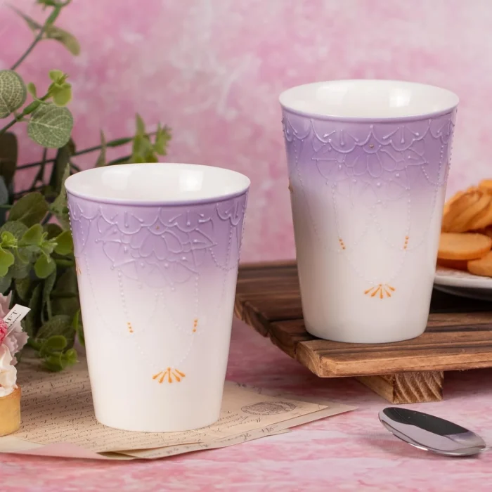 Two tall lavender-and-white ceramic cups together KAMMAK 7KPSP720N home decor product styled home decor setting image 5