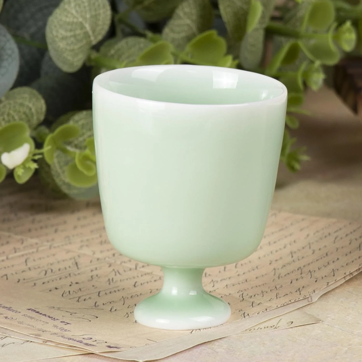 Single pale mint green ceramic pedestal cup