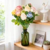 Pastel rose bouquet arranged in a green glass bottle KAMMAK 8KPFZH012 home decor product styled home decor setting image 5