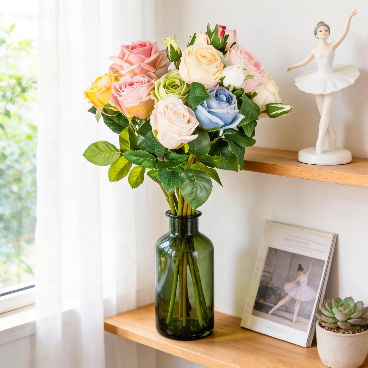Pastel rose bouquet arranged in a green glass bottle