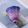 Blue-purple scalloped ceramic tea cup at an angle KAMMAK 7KPSP696N+697N ceramic cup and saucer close-up material texture detail image 4