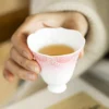 Pink scalloped ceramic tea cup held in one hand KAMMAK 7KPSP696N+697N ceramic cup and saucer decorative craft detail image 7