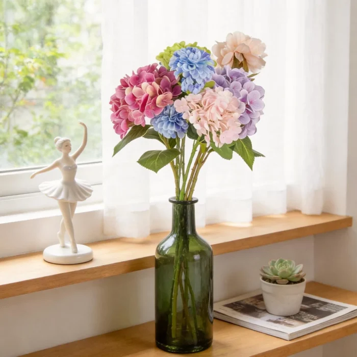 Colorful hydrangea arrangement in a green glass bottle KAMMAK 8KPFZH016 home decor product styled home decor setting image 5