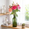 Bright rose bouquet displayed in a green glass bottle KAMMAK 8KPFZH013 home decor product styled home decor setting image 5