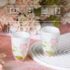 Pink floral ceramic tea cup care guidance KAMMAK 7KPSP709N ceramic cup and saucer side angle view showing silhouette