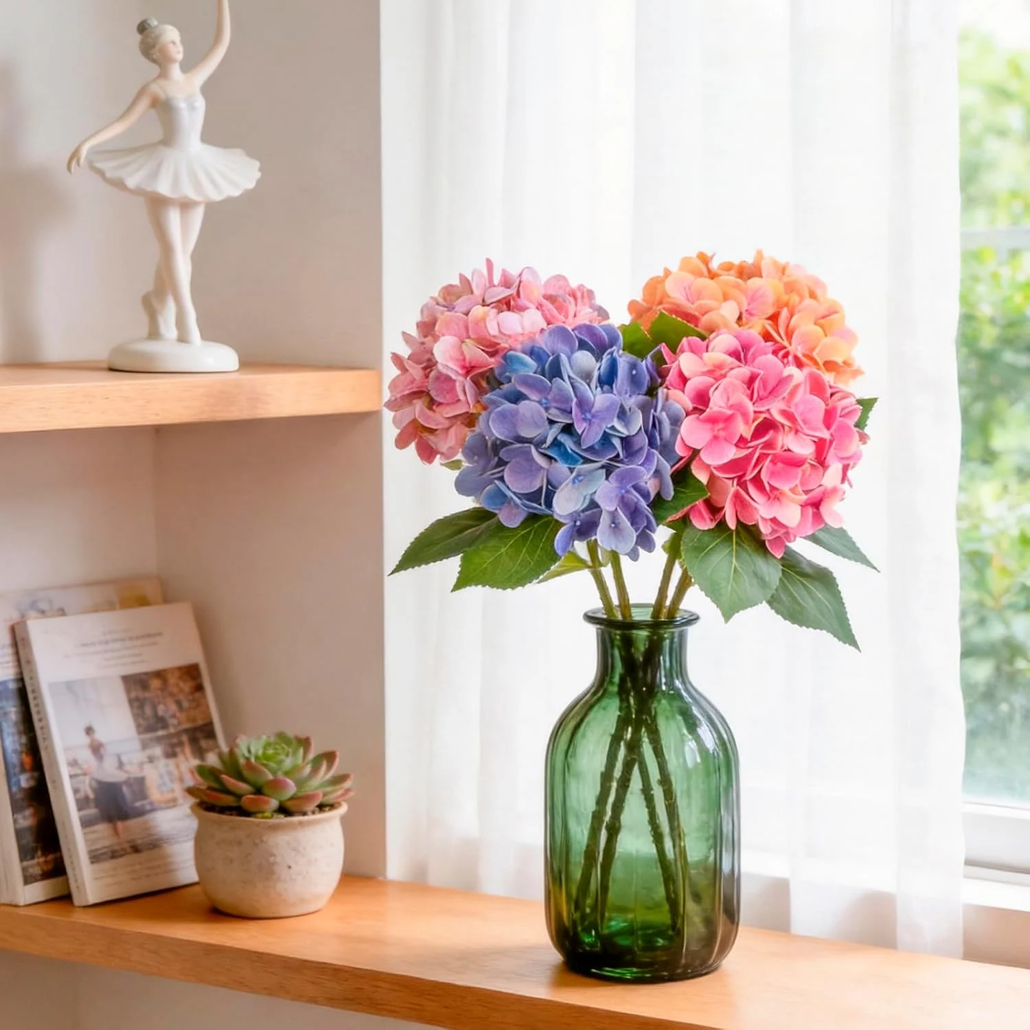 Colorful hydrangeas arranged in a green glass bottle on a shelf