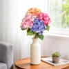 Multicolor hydrangea bouquet in a cream vase by a window KAMMAK 8KPFZH002 home decor product scale and proportion view image 6