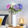 Mixed hydrangea arrangement in a white vase beside a sofa KAMMAK 8KPFZH008 home decor product decorative craft detail image 7