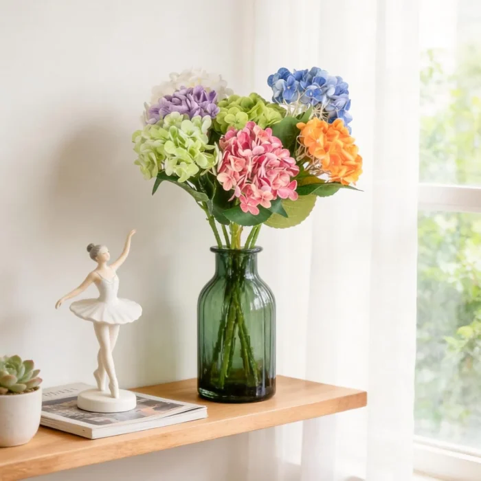Colorful hydrangea bouquet displayed in a green glass bottle KAMMAK 8KPFZH009 home decor product styled home decor setting image 5