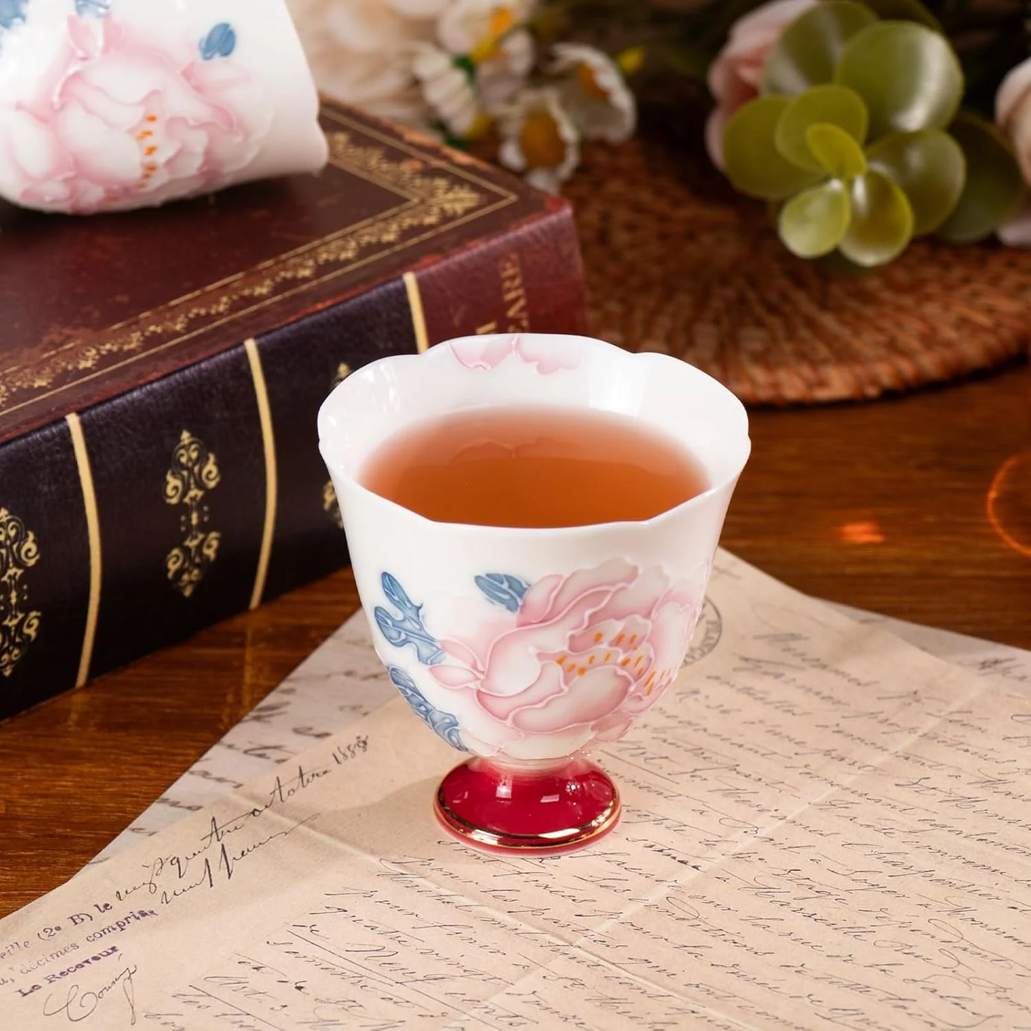 Scalloped peony porcelain cup filled with tea