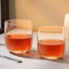 Two straight crystal whiskey glasses in a warm table setting KAMMAK 7KPSP765N whiskey glasses scale and proportion view image 6