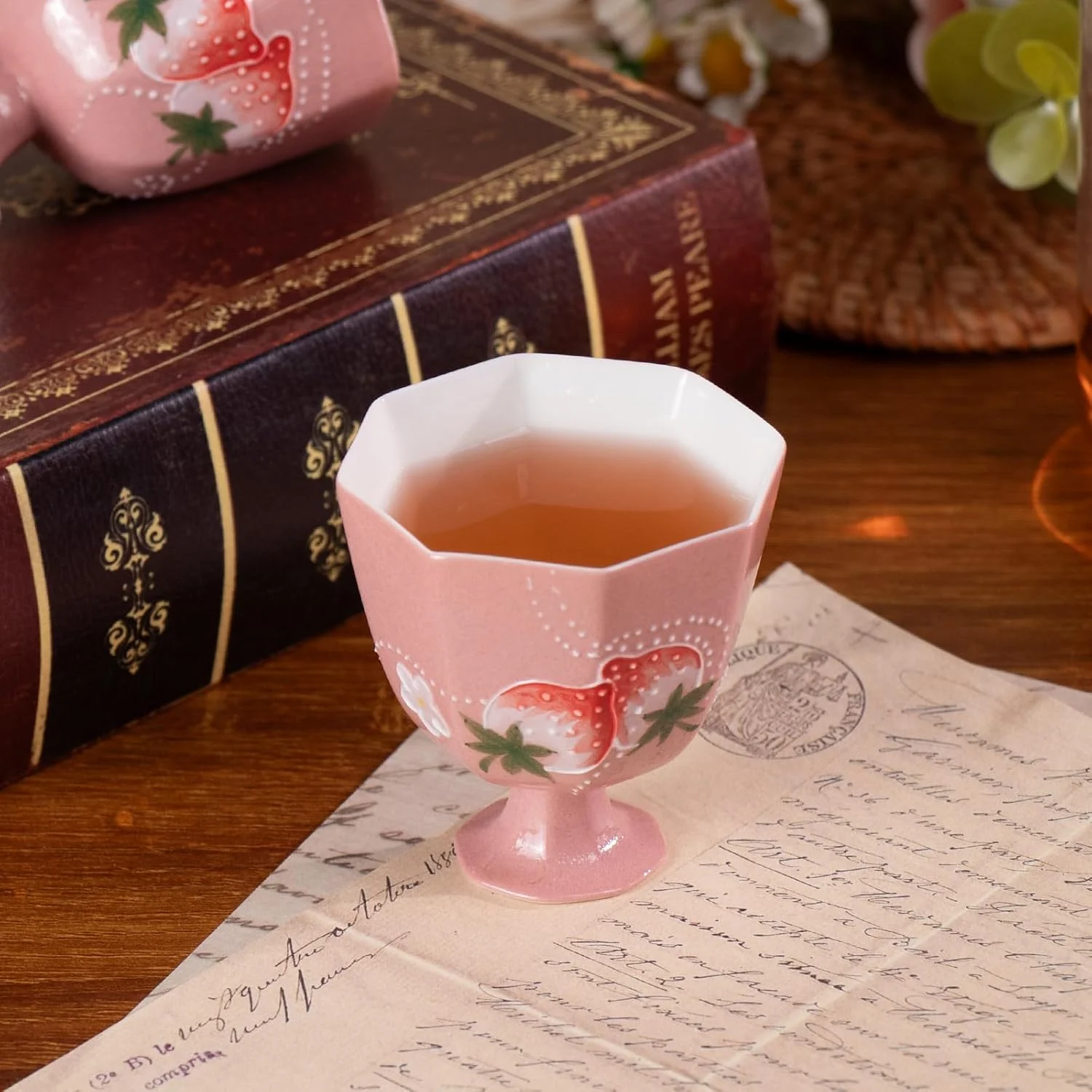 Strawberry porcelain tea cup filled for serving