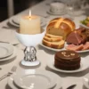White rabbit candle holder displayed on a dining table KAMMAK 7KPSP495N pillar candles side angle view showing silhouette