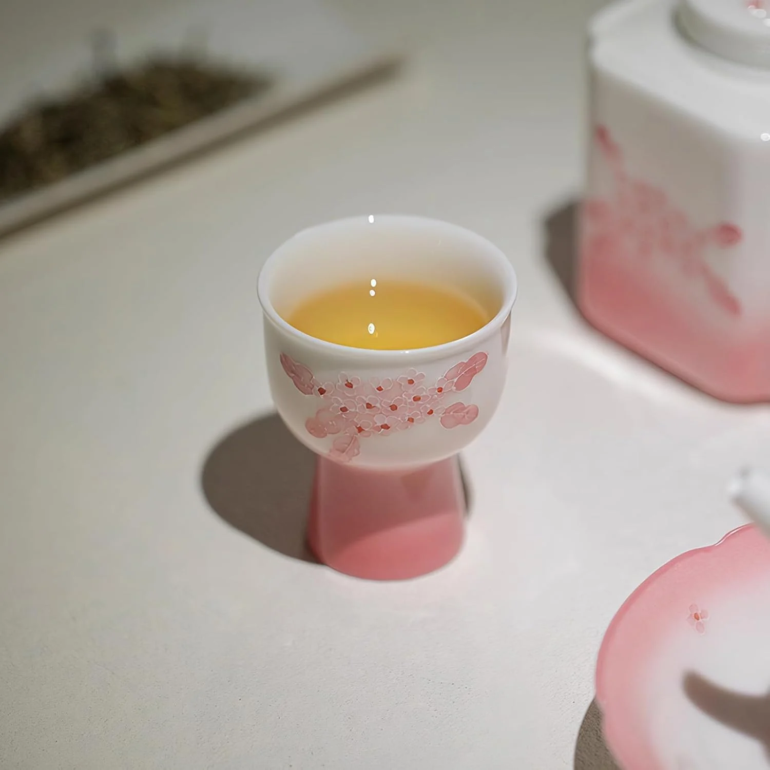 Single KAMMAK 714N pink floral footed cup filled with tea