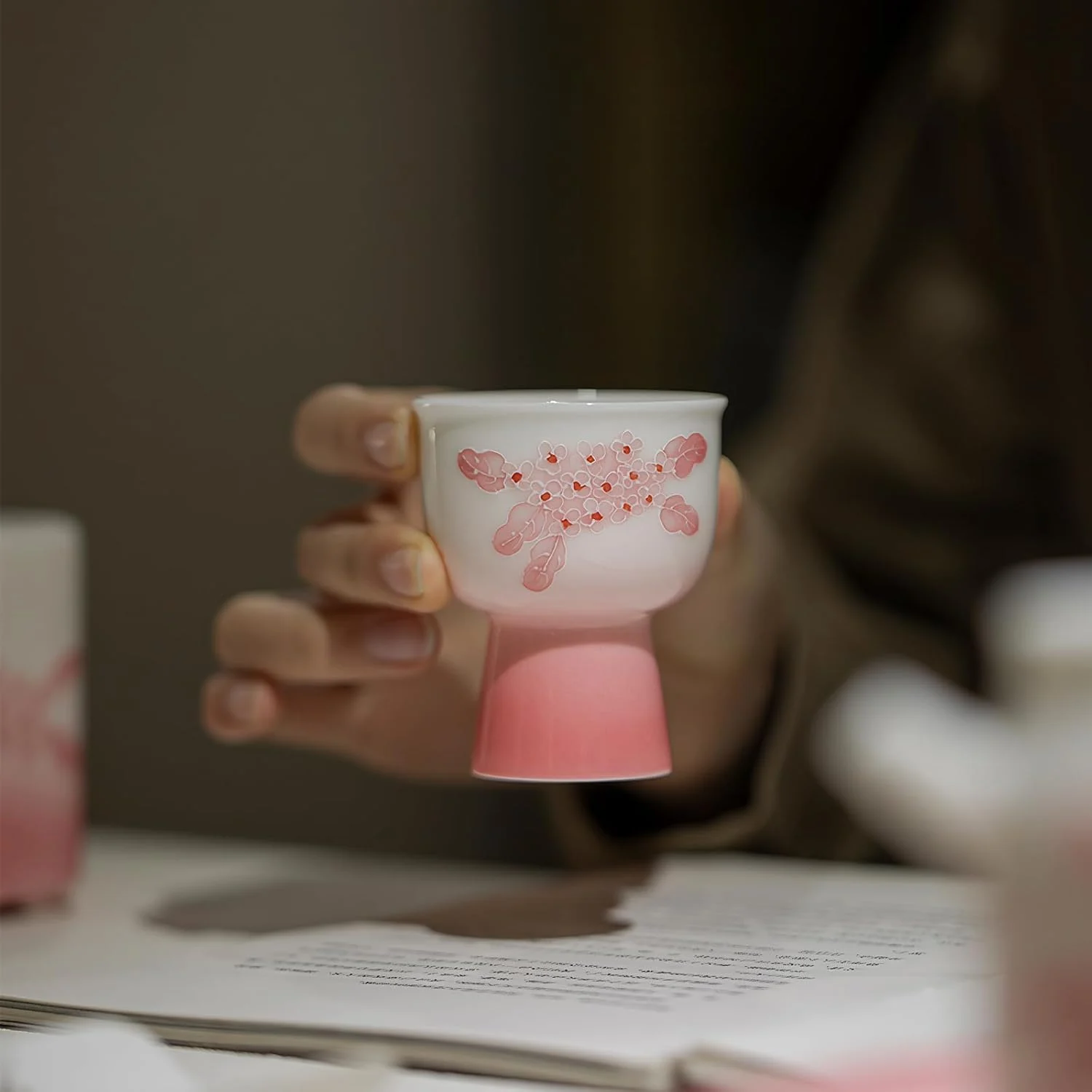 KAMMAK 714N pink floral tea cup held by its short footed base