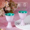 KAMMAK 717N pink and teal footed cups with care guidance icons KAMMAK 7KPSP717N ceramic cup and saucer side angle view showing silhouette