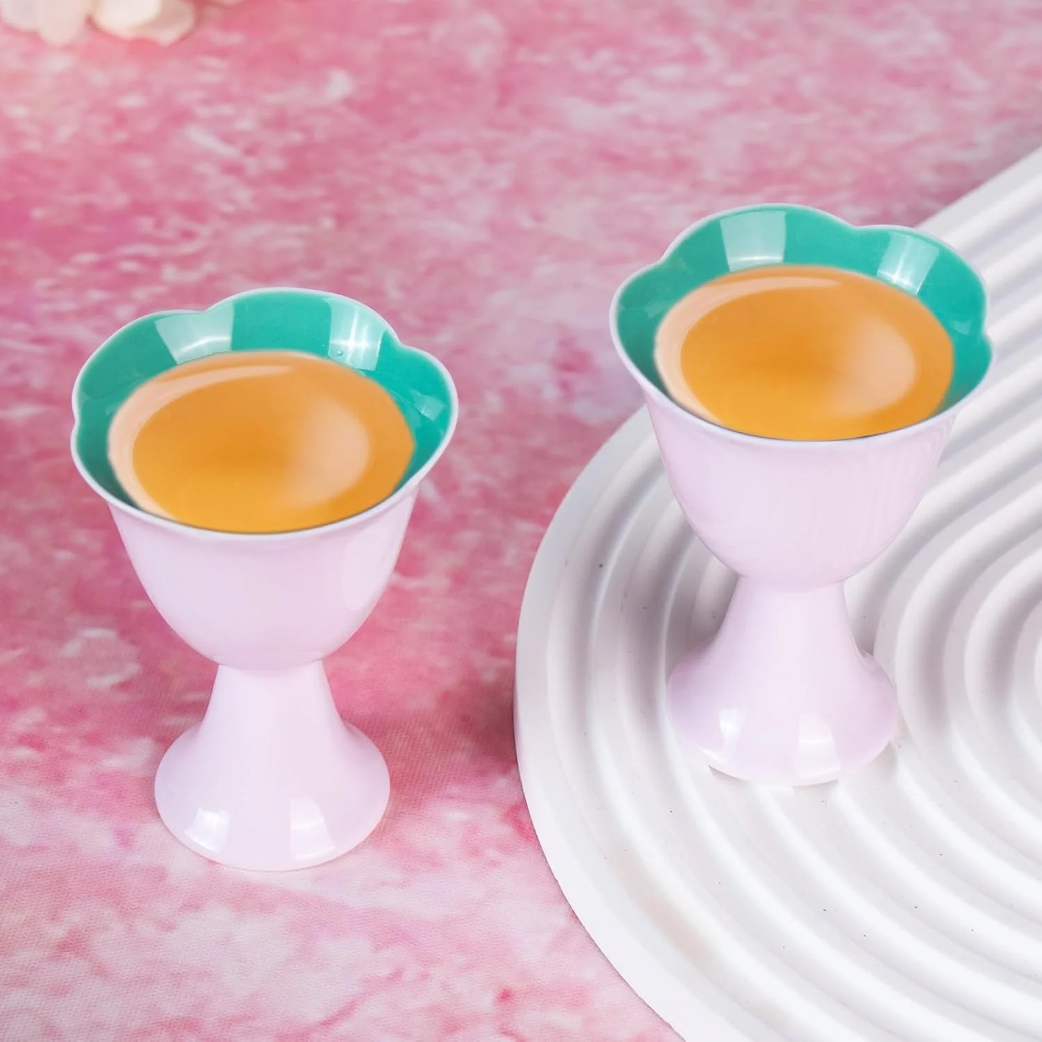 Top view of two KAMMAK 717N cups with teal flower-shaped interiors
