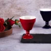 Single glossy red KAMMAK 680N footed tea cup on slate KAMMAK 7KPSP680N+681N ceramic cup and saucer close-up material texture detail image 4