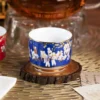 Close view of the blue KAMMAK porcelain tea cup and figure pattern KAMMAK 7KPSP424N ceramic cup and saucer close-up material texture detail image 4