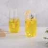 Two slim KAMMAK 766N glasses with pale citrus iced drinks KAMMAK 7KPSP766N home decor product close-up material texture detail image 4
